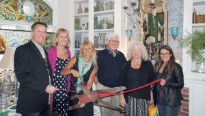Julie Bunce, cuts the ribbon with help from (left to right) Steve Polk, Marian Anderson, Alex Gough, Anne Gough and Carlee Porter during a special ribbon cutting with the San Luis Obispo Chamber of Commerce.